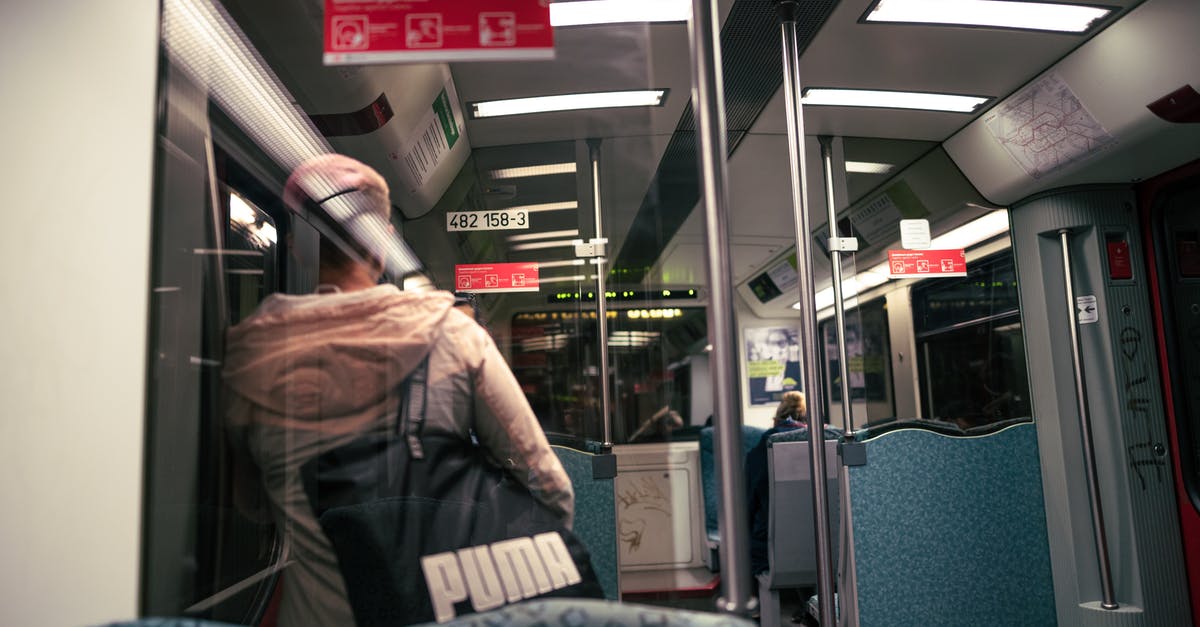 Tips to avoid forgetting a bag - Man in Brown Jacket Holding White and Blue Plastic Pack Tips to avoid forgetting a bag - Man in Brown Jacket Holding White and Blue Plastic Pack