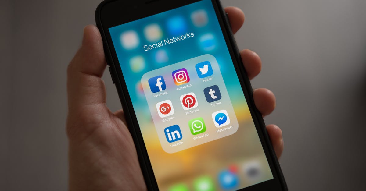 T-Mobile network in Thailand: Koh Phayam? - Person Holding Iphone Showing Social Networks Folder