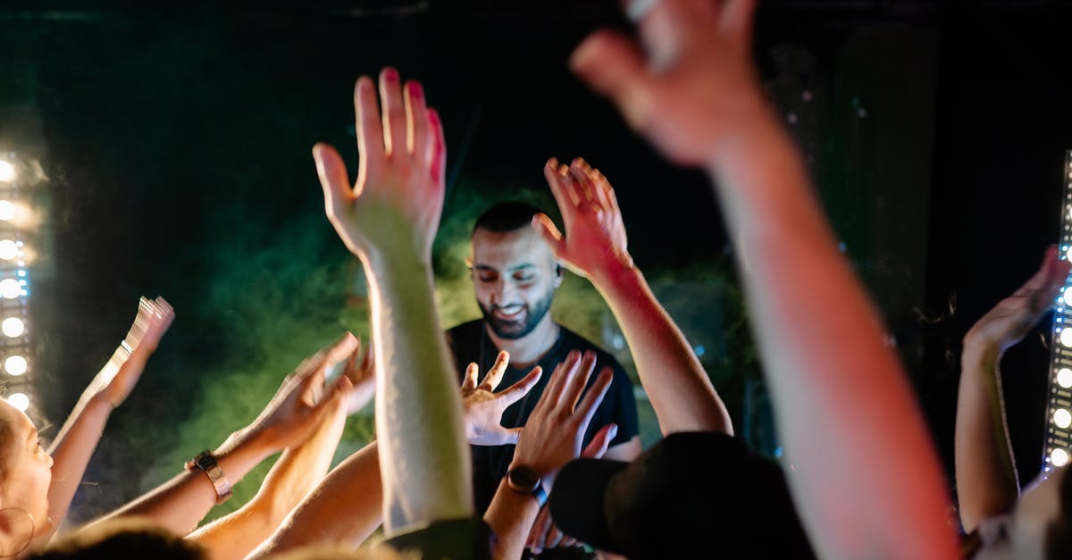 To have mStand in hand-luggage in Europe? - People Raising Their Hands during Nighttime To have mStand in hand-luggage in Europe? - People Raising Their Hands during Nighttime