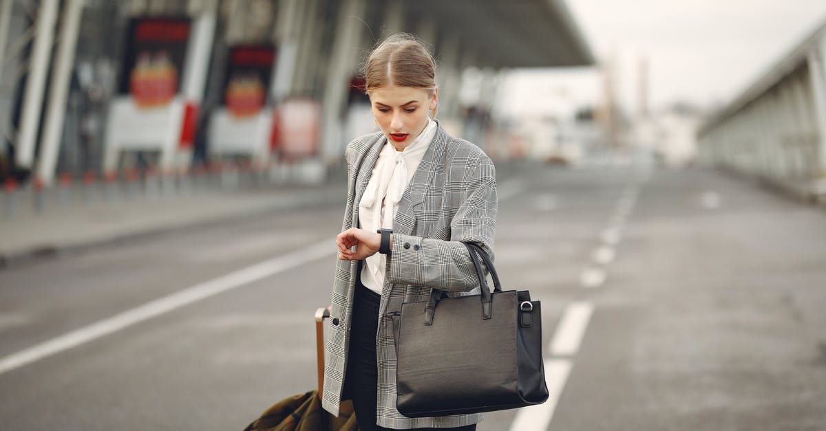 Toiletries allowed in checked baggage for Turkish Airlines? - Worried young businesswoman with suitcase hurrying on flight on urban background