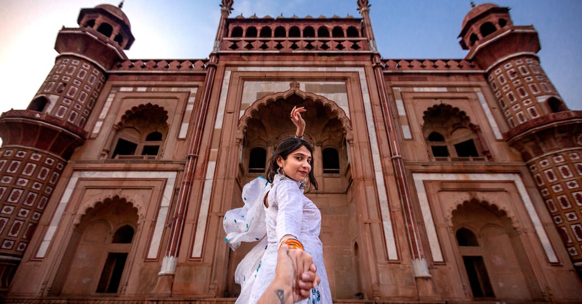 Tourist Visa while returning to India from Sweden - Woman Wearing White Dress Standing Near Building Tourist Visa while returning to India from Sweden - Woman Wearing White Dress Standing Near Building