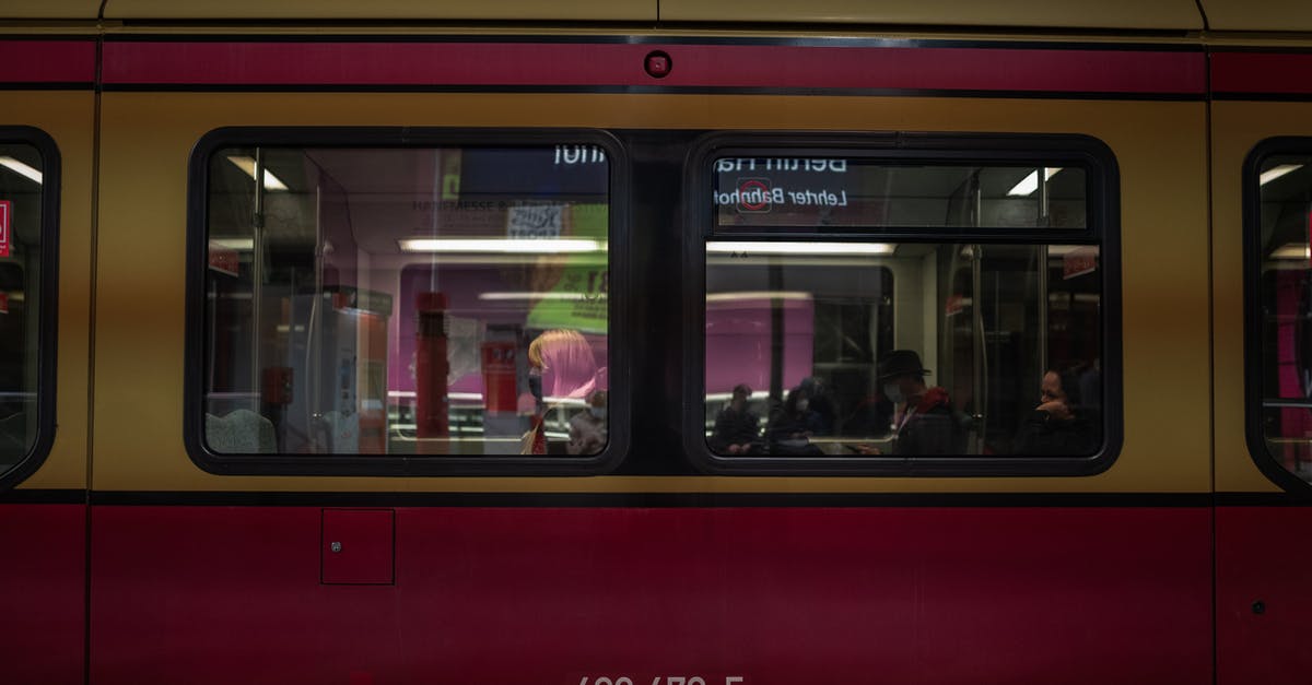 Train + rental car as alternative to air travel inside Europe - People in Red Train Train + rental car as alternative to air travel inside Europe - People in Red Train