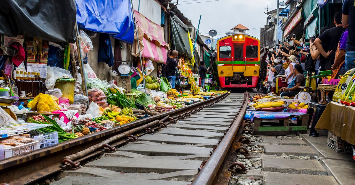 Trains in and out of Bangkok around Songkran - Maeklong Railway Market in Bangkok, Thailand Trains in and out of Bangkok around Songkran - Maeklong Railway Market in Bangkok, Thailand