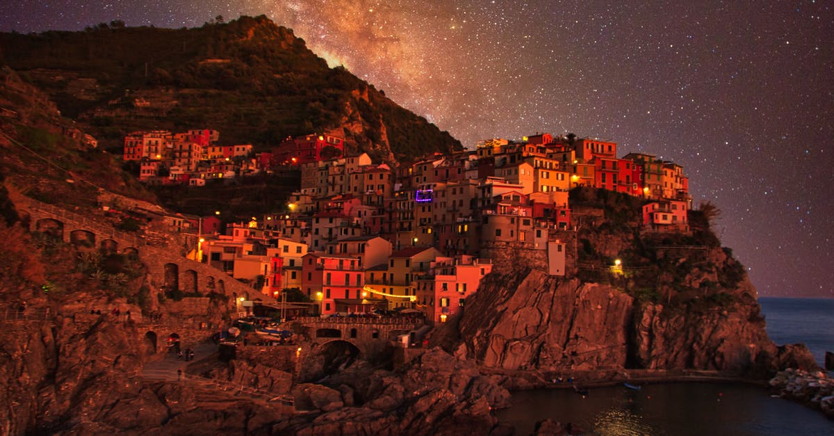 Trains in the Cinque Terre - The Colorful Cinque Terre Village in Manarola Italy at Night Trains in the Cinque Terre - The Colorful Cinque Terre Village in Manarola Italy at Night