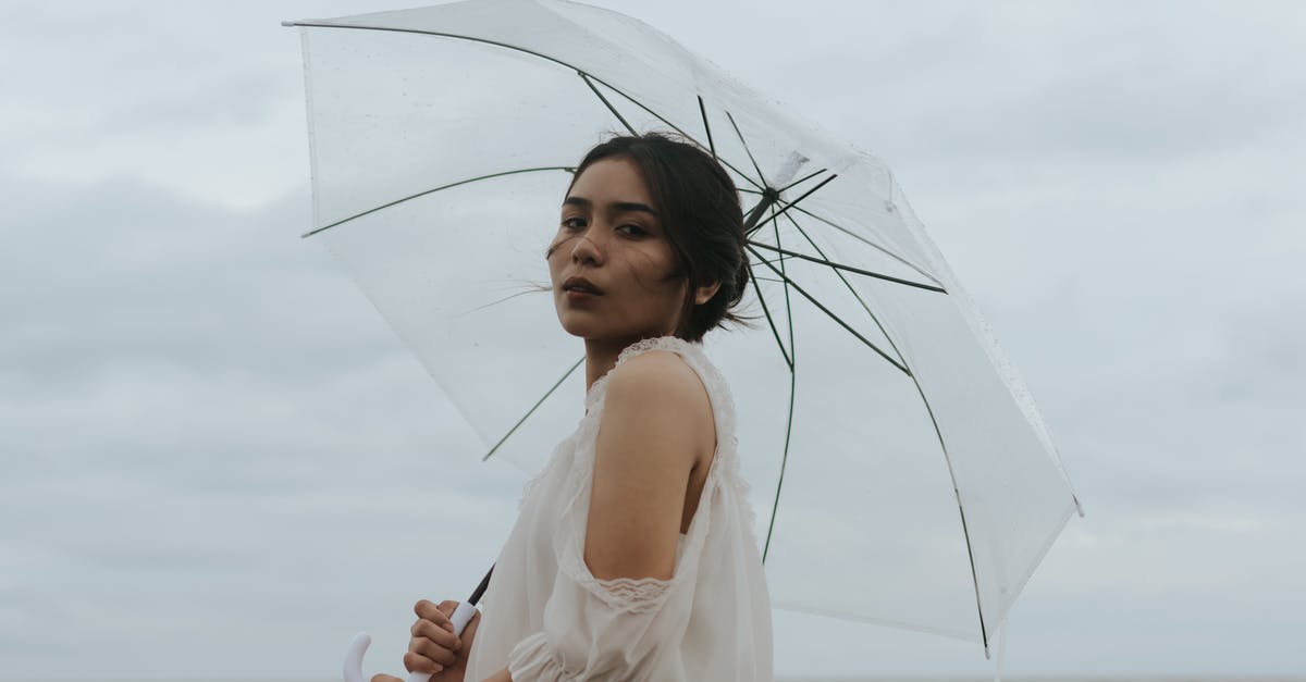Transatlantic cruises allowing casual dressing? - Photo Of Woman Holding Umbrella Transatlantic cruises allowing casual dressing? - Photo Of Woman Holding Umbrella