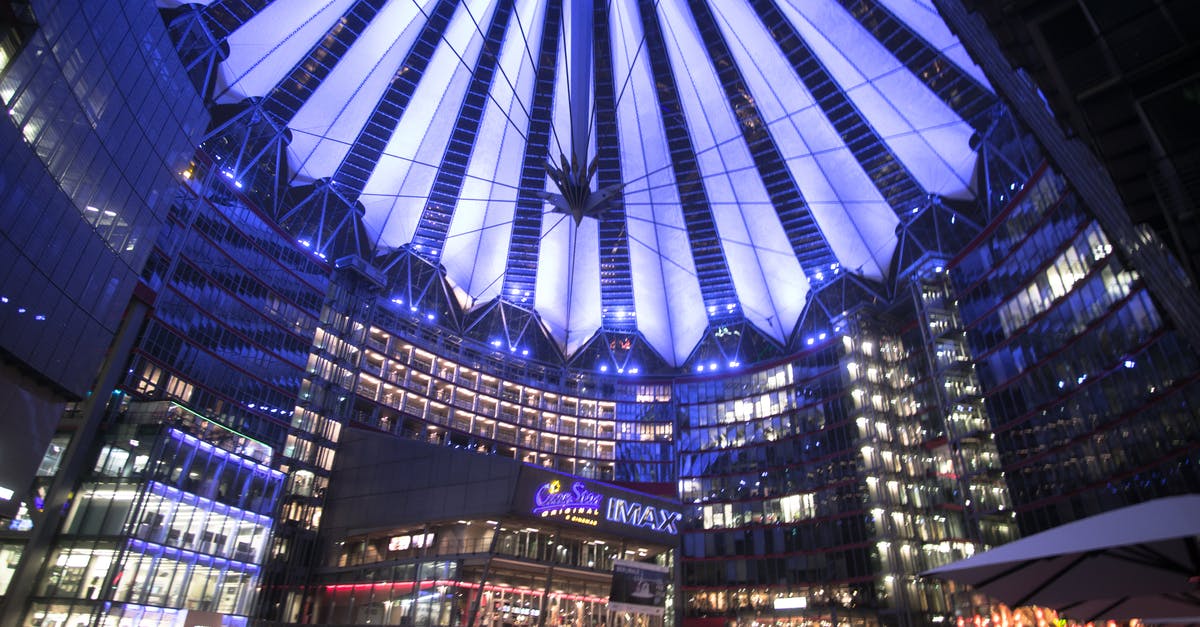 Transfer from Tegel Berlin to city center - Spectacular modern complex with illuminated glass roof at night Transfer from Tegel Berlin to city center - Spectacular modern complex with illuminated glass roof at night