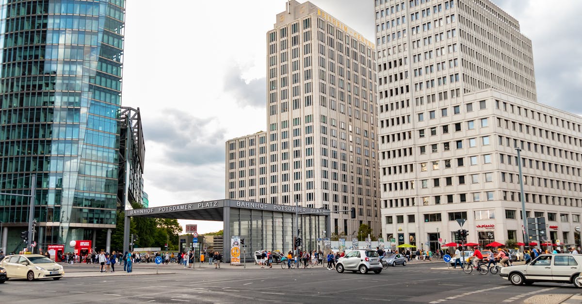 Transfer from Tegel Berlin to city center - Cars on Road Near High Rise Buildings Transfer from Tegel Berlin to city center - Cars on Road Near High Rise Buildings