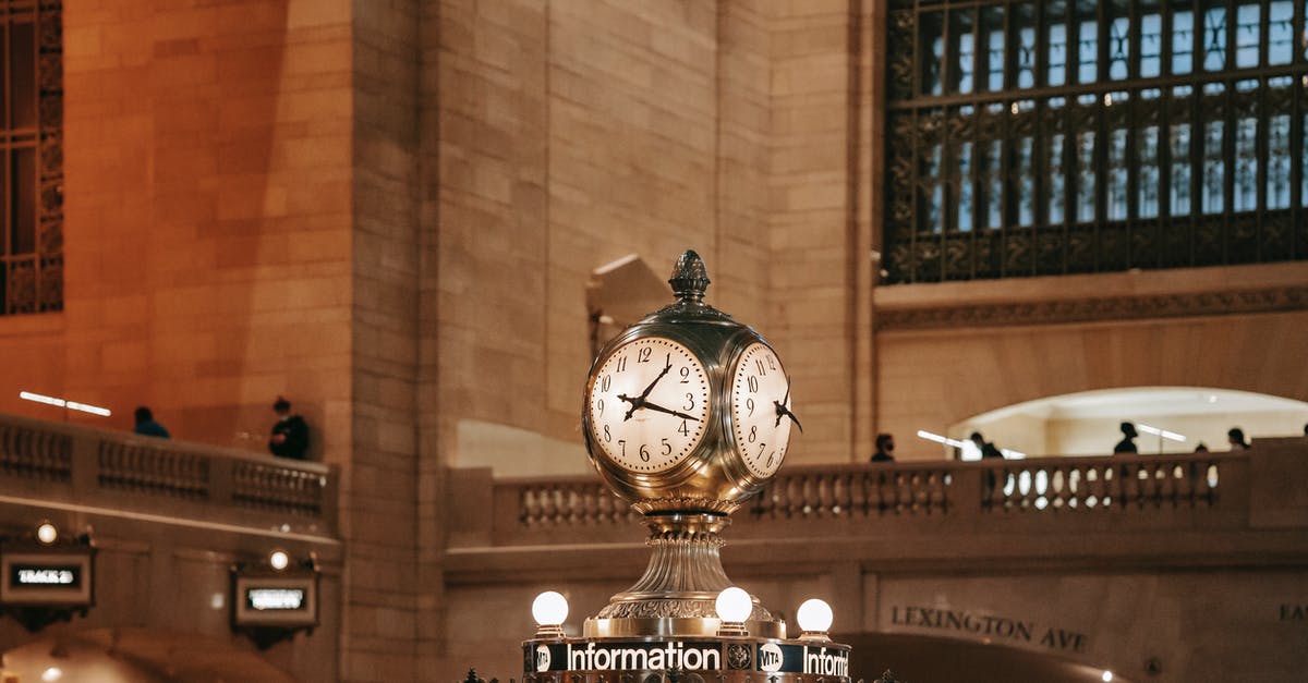 Transit stop in Helsinki for 21 hours on Finnair - Railway station with clock in classic building Transit stop in Helsinki for 21 hours on Finnair - Railway station with clock in classic building