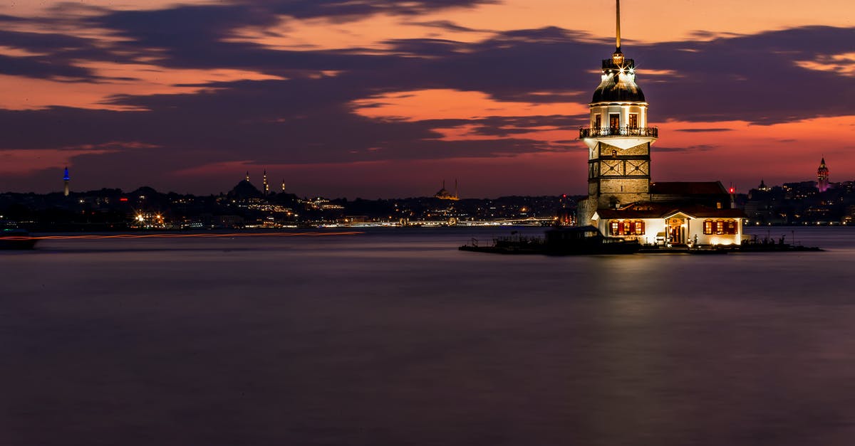 Transit Visa / Stopover in Istanbul - White and Brown Concrete Building Near Body of Water during Sunset Transit Visa / Stopover in Istanbul - White and Brown Concrete Building Near Body of Water during Sunset