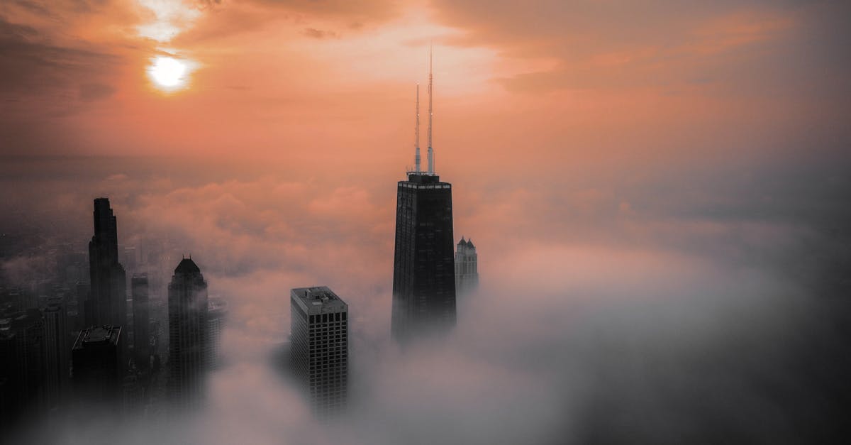 Transit visa for 5 hours layover in Chicago (USA) [duplicate] - Skyscrapers Above Clouds