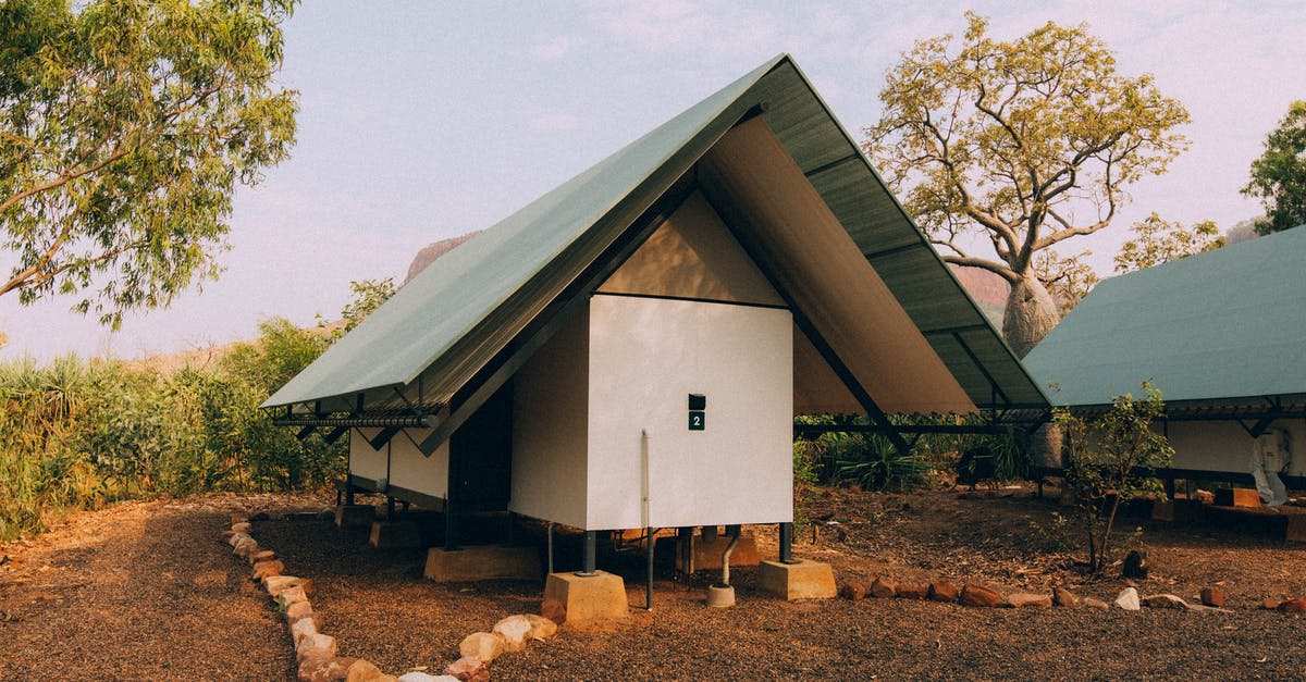 Transit visa for Australia - White and Gray Wooden House Near Trees Transit visa for Australia - White and Gray Wooden House Near Trees
