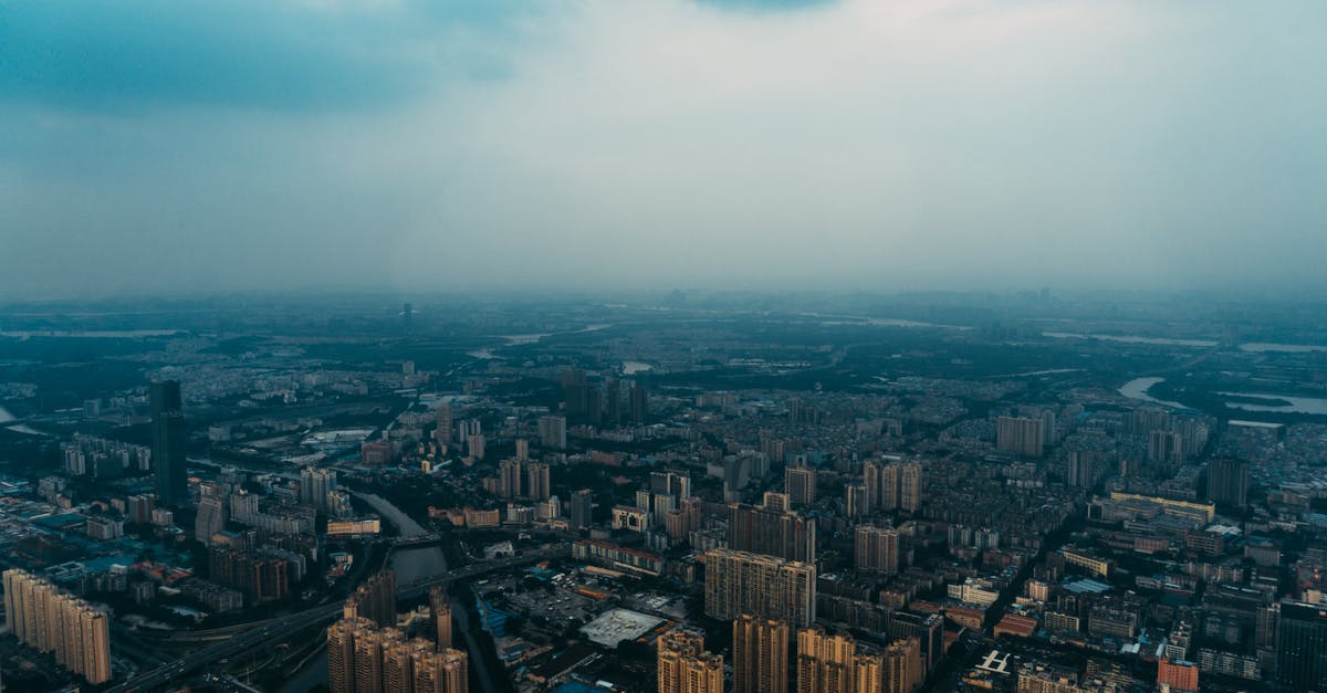 Transit Visa for China for layover in Guangzhou and Wuhan - Aerial Photography of Brown City Buildings Transit Visa for China for layover in Guangzhou and Wuhan - Aerial Photography of Brown City Buildings