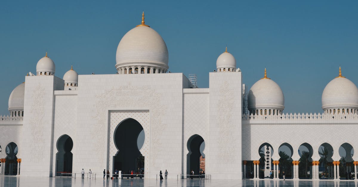 Transit Visa requirement in Belgrade and Abu Dhabi - View of Mosque in City Against Clear Sky Transit Visa requirement in Belgrade and Abu Dhabi - View of Mosque in City Against Clear Sky