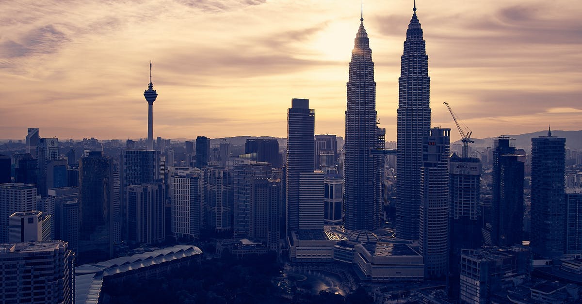 Transiting at Kuala Lumpur - View of Cityscape Against Sky during Sunset Transiting at Kuala Lumpur - View of Cityscape Against Sky during Sunset