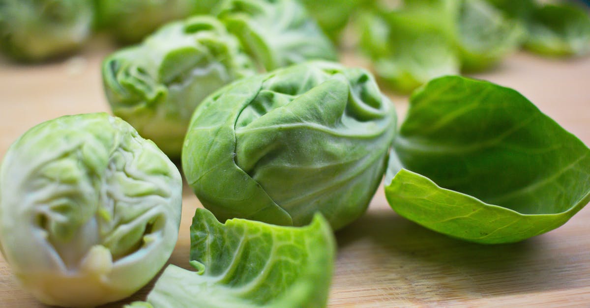 Transiting through Brussels [closed] - Closeup of ripe fresh Brussels sprouts with peels placed on wooden cutting board