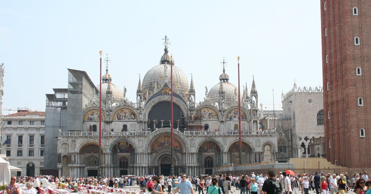 Transiting via Madrid to Venice - Crowd on Plaza Before Saint Marks Basilica in Venice, Italy Transiting via Madrid to Venice - Crowd on Plaza Before Saint Marks Basilica in Venice, Italy