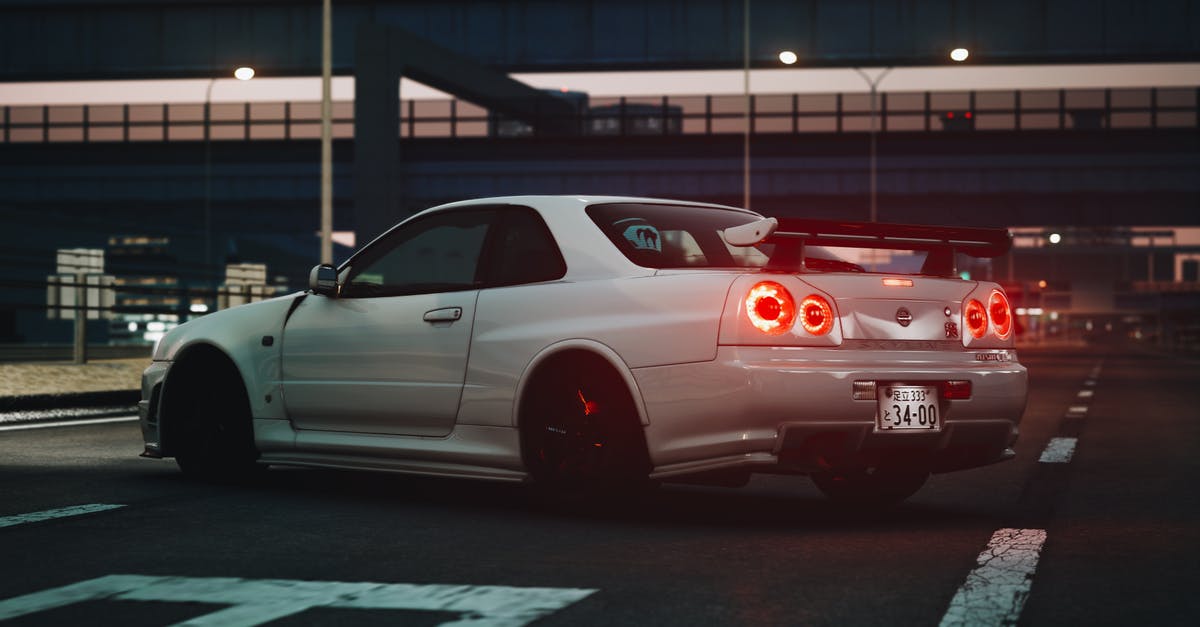 Transportation in Miyazaki Japan - A White Nissan Coupe Car Parked on the Road Transportation in Miyazaki Japan - A White Nissan Coupe Car Parked on the Road