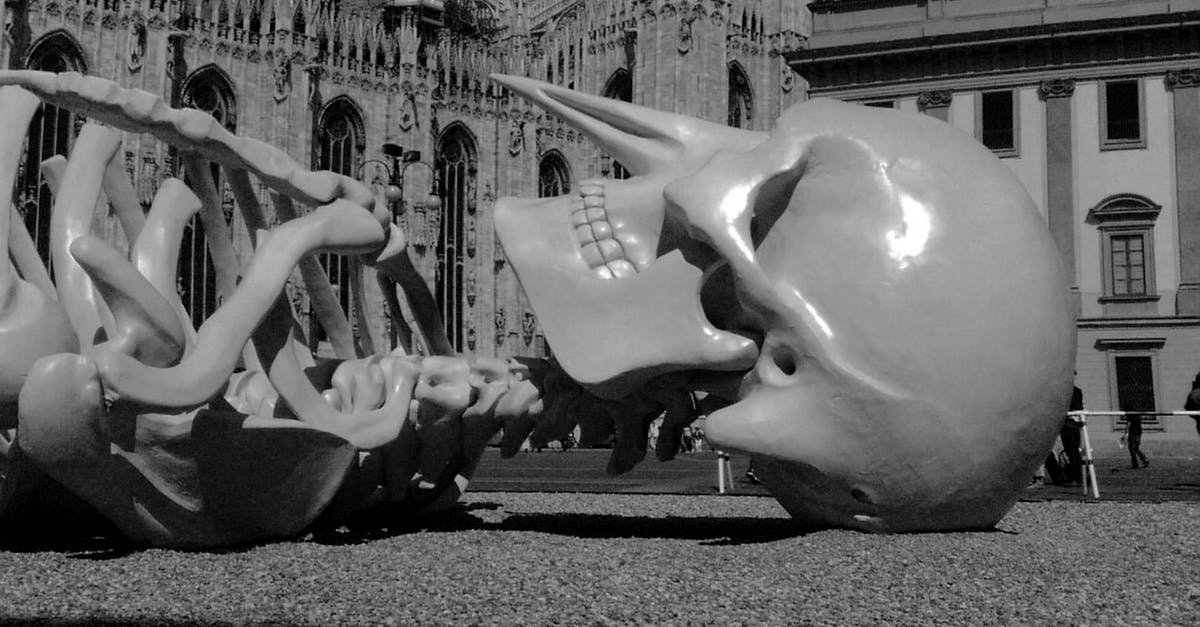 Travel Doctor vs GP for vaccinations - Art skeleton sculpture on cathedral square Travel Doctor vs GP for vaccinations - Art skeleton sculpture on cathedral square