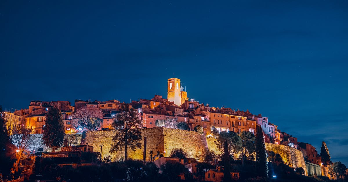 Travel from France to Saint Louis, do I need to pick up my luggage when transiting in the US? [duplicate] - From below of amazing aged Saint Paul de Vence commune with illuminated buildings and ancient bell tower located on hill against evening sky