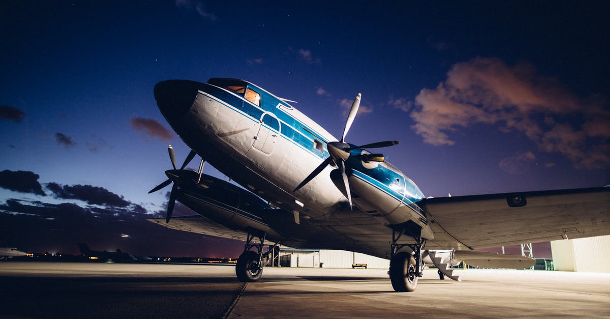 Travel from Gimpo airport to Incheon airport during night - Airplane with propellers on aerodrome Travel from Gimpo airport to Incheon airport during night - Airplane with propellers on aerodrome