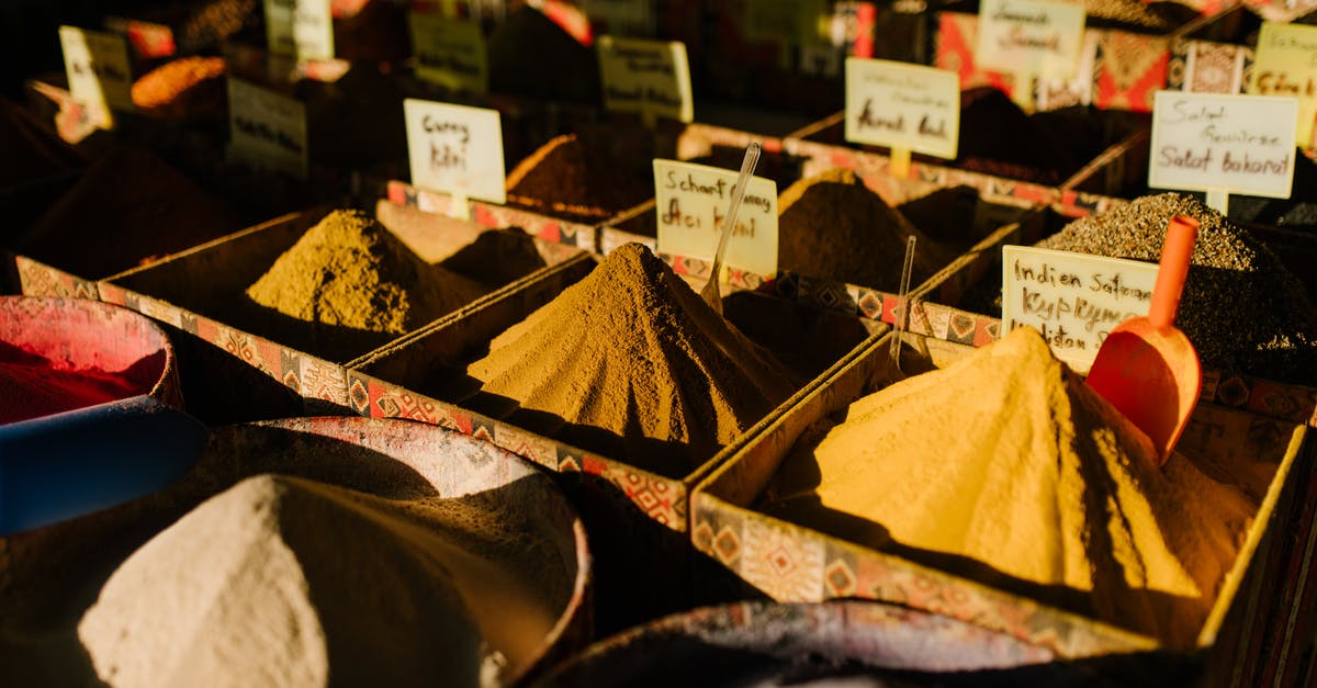 Travel from Hanoi to Chiang Mai via BKK by Qatar/Bangkok airways. What is the luggage allowance, how many pieces and dimensions? - Traditional market stall with various aromatic spices