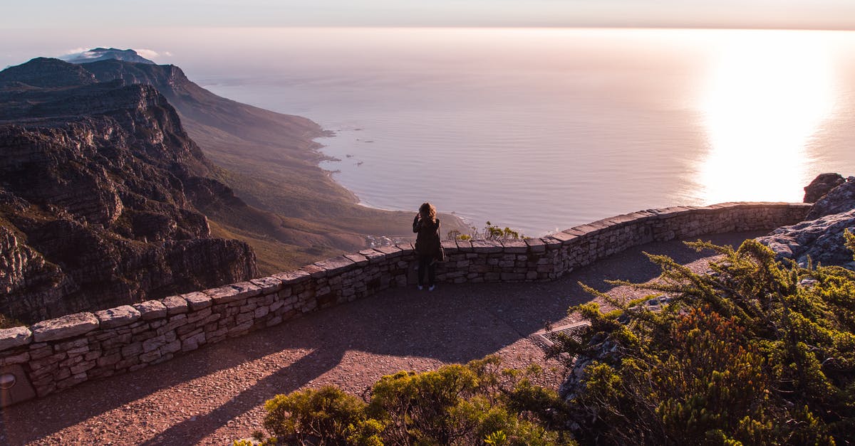 Travel from South Africa to Croatia via Germany - Person Standing Across Body of Water Travel from South Africa to Croatia via Germany - Person Standing Across Body of Water