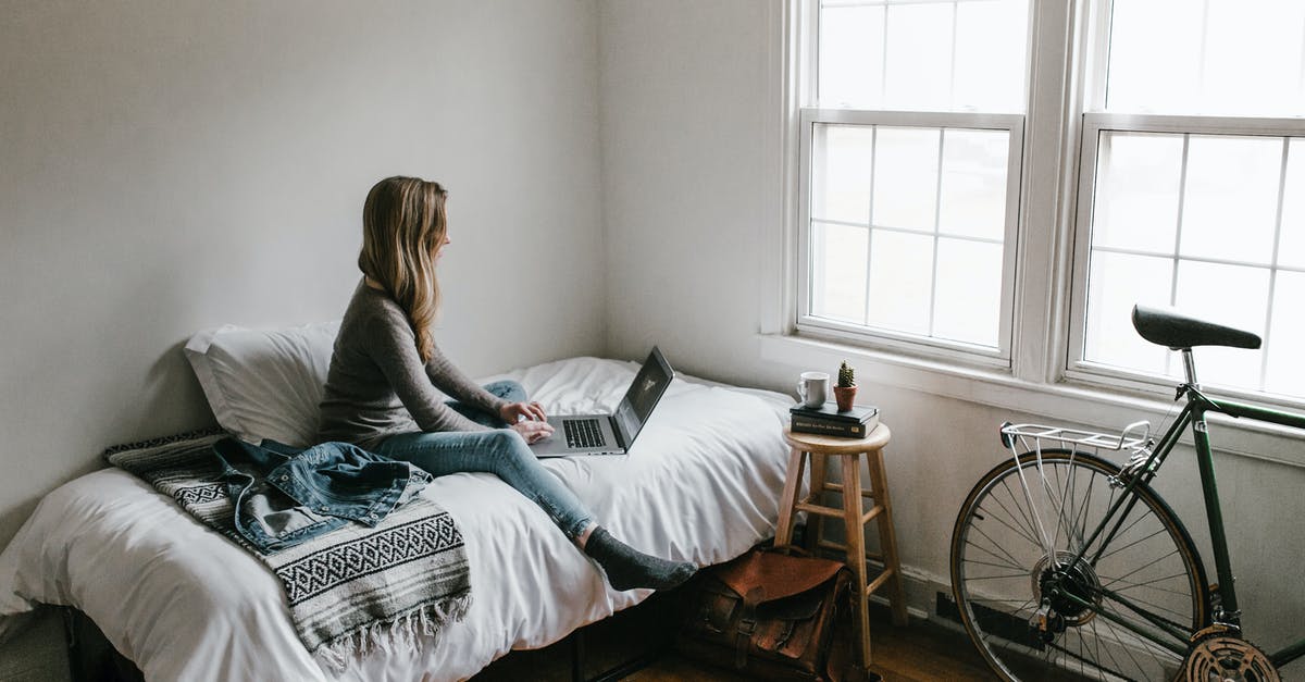Travel inside the EU with expired student visa - Woman in Gray Shirt Sitting on Bed Travel inside the EU with expired student visa - Woman in Gray Shirt Sitting on Bed