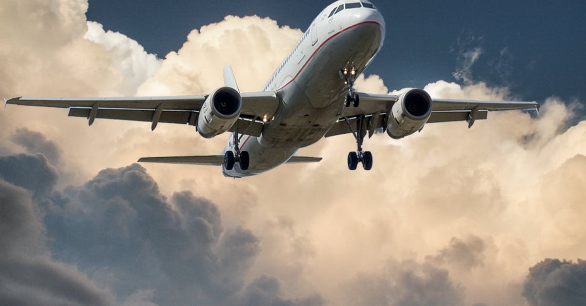 Travel insurance for flight cancellation - White and Red Plane Beside Clouds Low-angle Photography Travel insurance for flight cancellation - White and Red Plane Beside Clouds Low-angle Photography