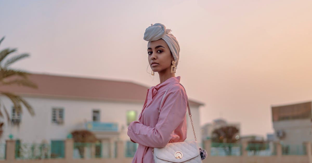 Travel insurance for jewellery and electronics - Selective-focus Photograph of Woman in Pink Dress With Leather Bag Travel insurance for jewellery and electronics - Selective-focus Photograph of Woman in Pink Dress With Leather Bag
