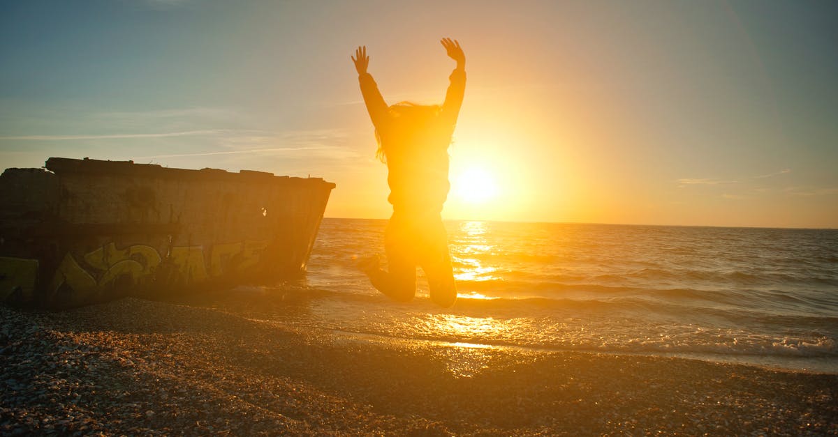 Travel to Ercan enroute Larnaca - Person Jumping on Seashore during Golden Hour Travel to Ercan enroute Larnaca - Person Jumping on Seashore during Golden Hour