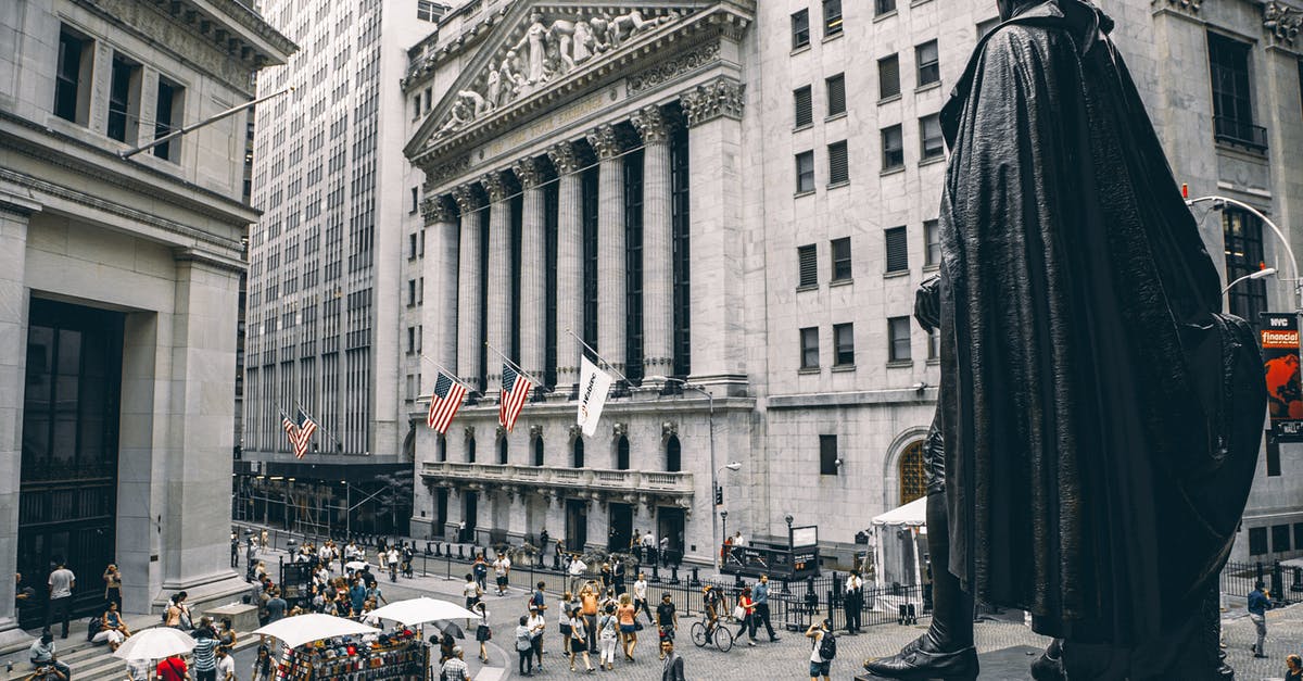 Travel to USA with visa in expiring passport [duplicate] - People Walking on Street Near Building