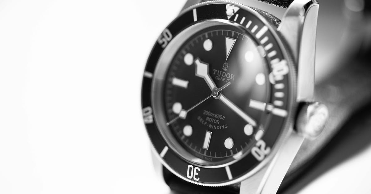 Traveling abroad with an expensive watch - Grayscale Photography of Tudor Analog Watch Traveling abroad with an expensive watch - Grayscale Photography of Tudor Analog Watch