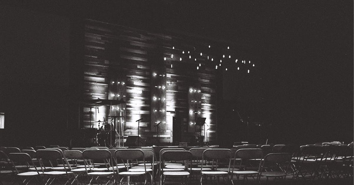 Traveling for a Conference - Grayscale Photography Of Chairs In An Auditorium Traveling for a Conference - Grayscale Photography Of Chairs In An Auditorium