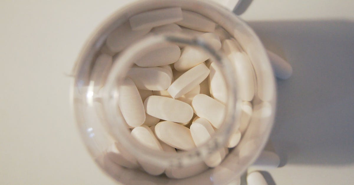 Traveling from Europe to Beijing, China with prescription drugs - White Medication Pills in Clear Glass Jar Traveling from Europe to Beijing, China with prescription drugs - White Medication Pills in Clear Glass Jar