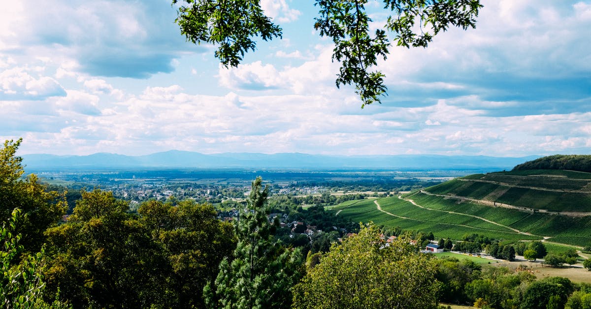 Traveling in Schengen area before going to the country that my type D visa is for - Scenic view of lush spacious terrain with small town under clear blue sky on peaceful summer day Traveling in Schengen area before going to the country that my type D visa is for - Scenic view of lush spacious terrain with small town under clear blue sky on peaceful summer day