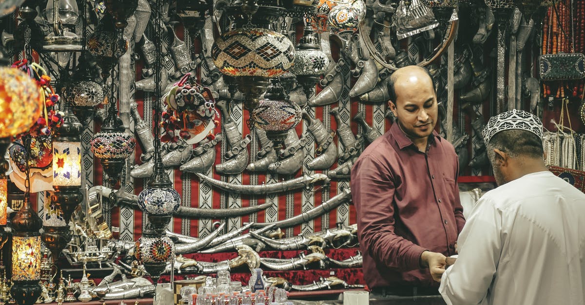 Traveling inspecting flights and customer service - Oriental souvenir shop counter with seller and customer Traveling inspecting flights and customer service - Oriental souvenir shop counter with seller and customer