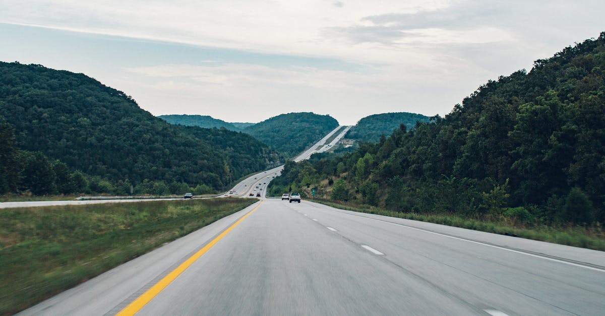Traveling to Belarus with dual citizenship - Road Between Green Leafed Trees Traveling to Belarus with dual citizenship - Road Between Green Leafed Trees
