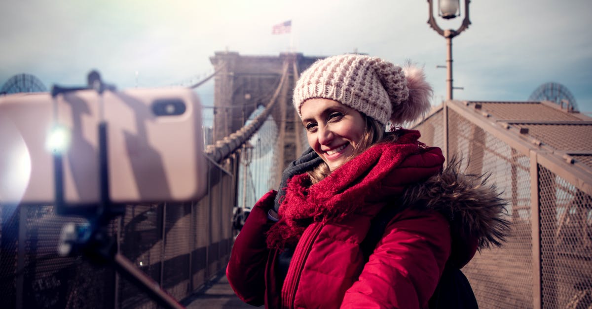 Traveling to the USA - Phone coverage and solutions - Woman Wearing Red Zip-up Hooded Jacket Traveling to the USA - Phone coverage and solutions - Woman Wearing Red Zip-up Hooded Jacket
