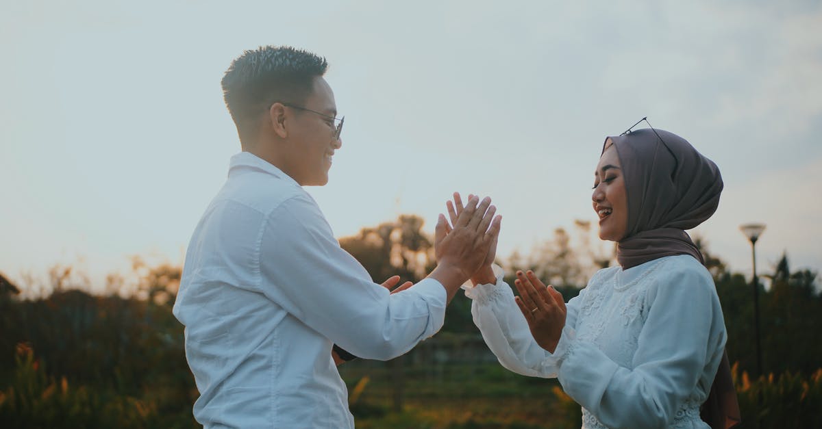 Travelling as an unmarried Western couple in Indonesia - Man and Woman Wearing White Tops Travelling as an unmarried Western couple in Indonesia - Man and Woman Wearing White Tops