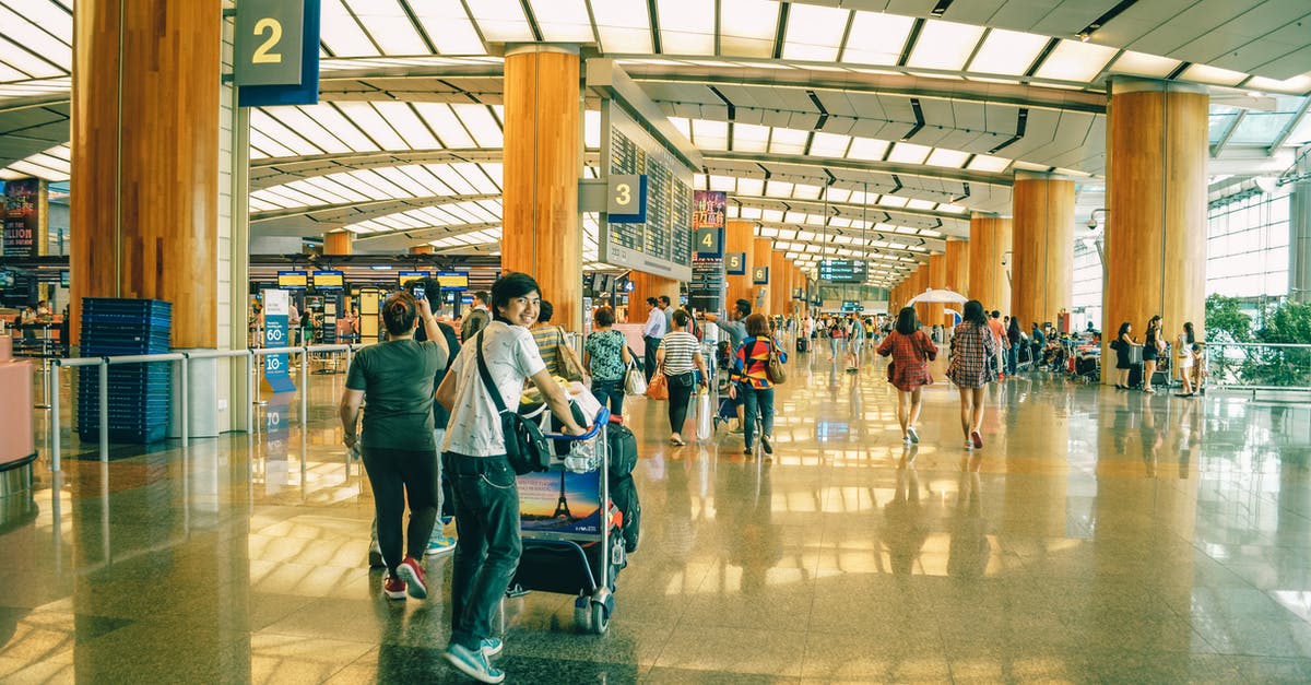 Travelling outside Singapore on Multiple Entry Visa after EP cancelled - People Standing Inside Airport Travelling outside Singapore on Multiple Entry Visa after EP cancelled - People Standing Inside Airport