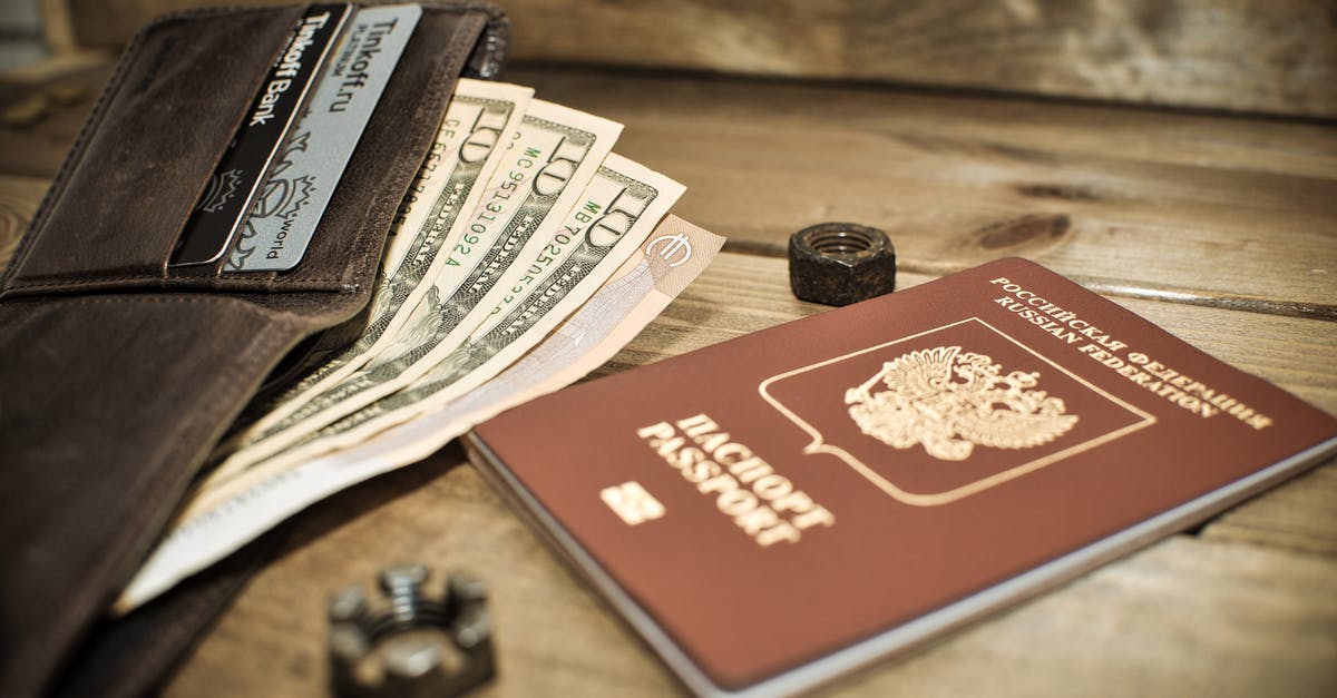 Travelling through Turkey with Russian Passport - Photo of a Brown Passport Beside a Wallet with Dollar Bills Travelling through Turkey with Russian Passport - Photo of a Brown Passport Beside a Wallet with Dollar Bills