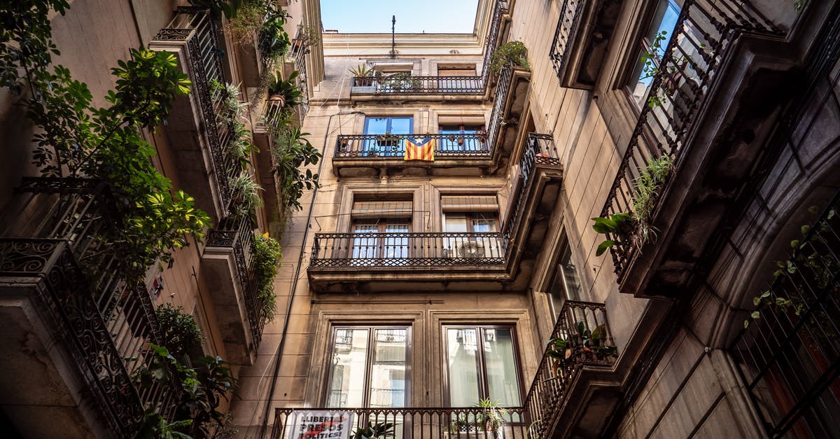 Travelling to Algeria through Barcelona - Low-angle Photography of Brown Building Travelling to Algeria through Barcelona - Low-angle Photography of Brown Building