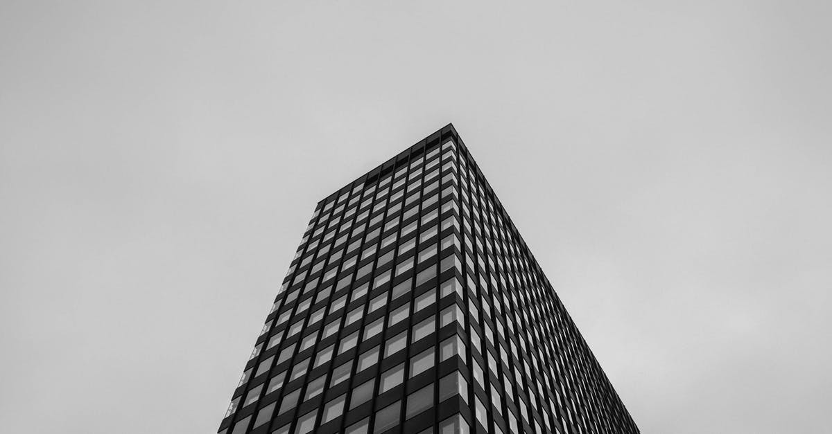 Travelling to Berlin without a bank statement - Curtain Building in Low-angle Photography Travelling to Berlin without a bank statement - Curtain Building in Low-angle Photography