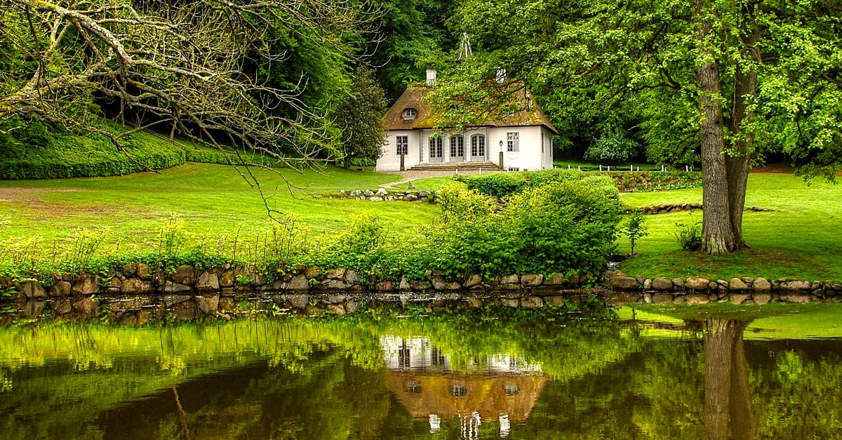 Travelling to Denmark with permit of stay receipt only - White and Brown House Surrounded by Trees Travelling to Denmark with permit of stay receipt only - White and Brown House Surrounded by Trees