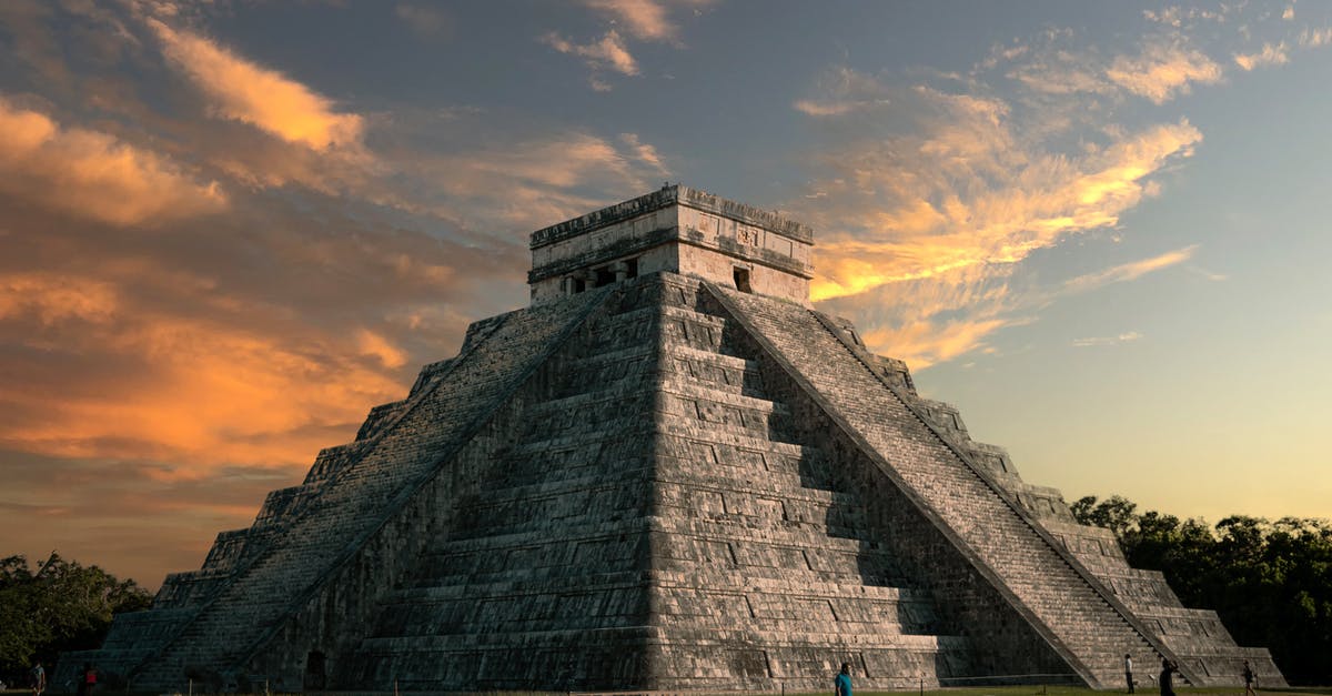 Travelling to Mexico with an Italian carta di soggiorno illimitata - Gray Concrete Building Under Cloudy Sky Travelling to Mexico with an Italian carta di soggiorno illimitata - Gray Concrete Building Under Cloudy Sky