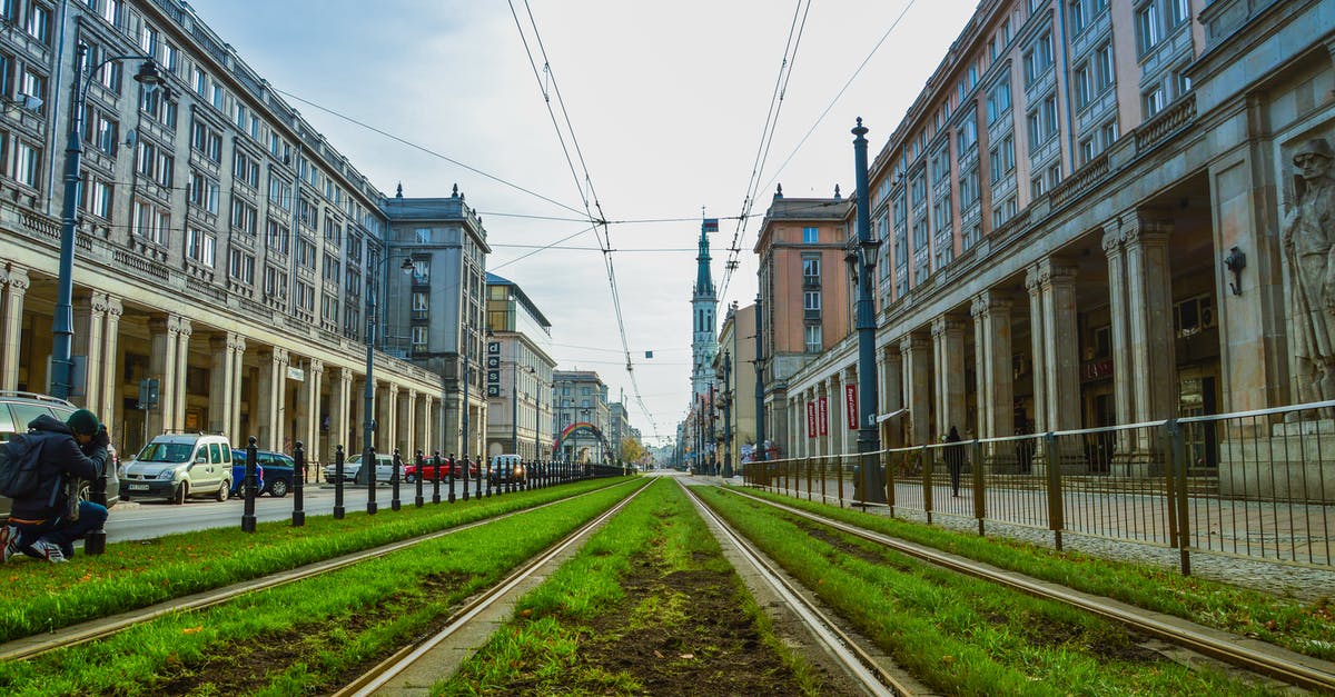 Travelling to Poland alone at the age of 17 - Green Grass Between Concrete Buildings Travelling to Poland alone at the age of 17 - Green Grass Between Concrete Buildings