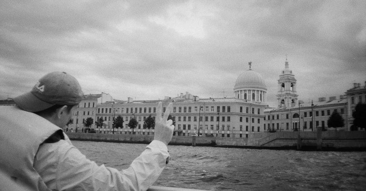 Travelling to Russia with engagement ring? - Grayscale Photo of Man Looking at the River Travelling to Russia with engagement ring? - Grayscale Photo of Man Looking at the River