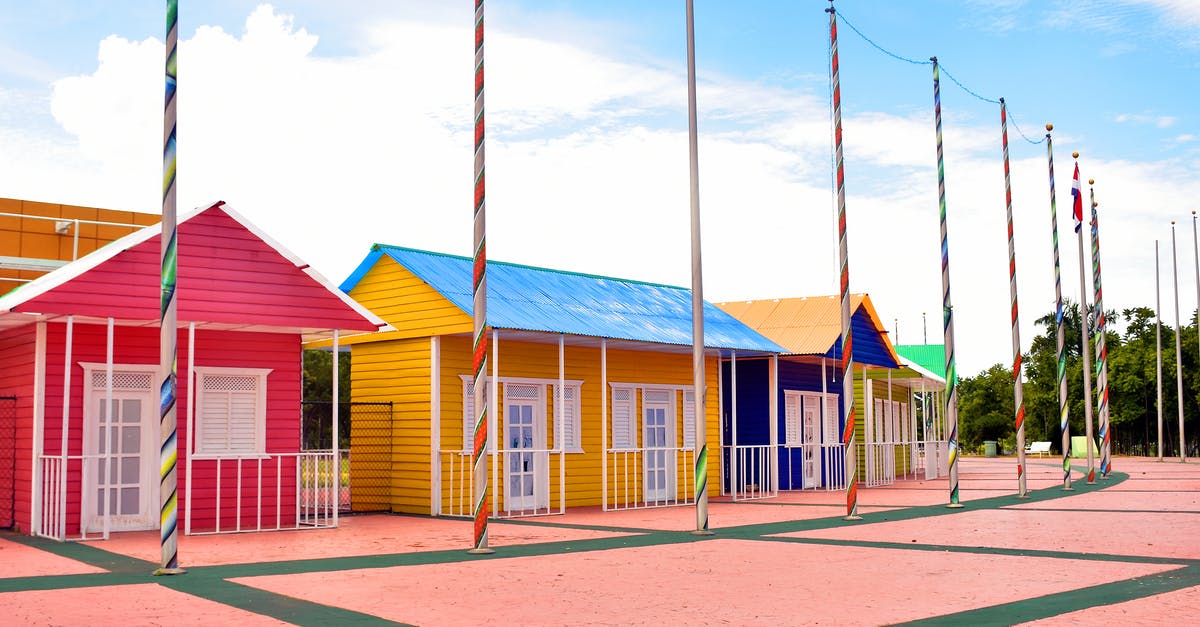 Travelling to Schengen with Romania Temporary Residence Permit - Assorted-color House Facade in Park Travelling to Schengen with Romania Temporary Residence Permit - Assorted-color House Facade in Park