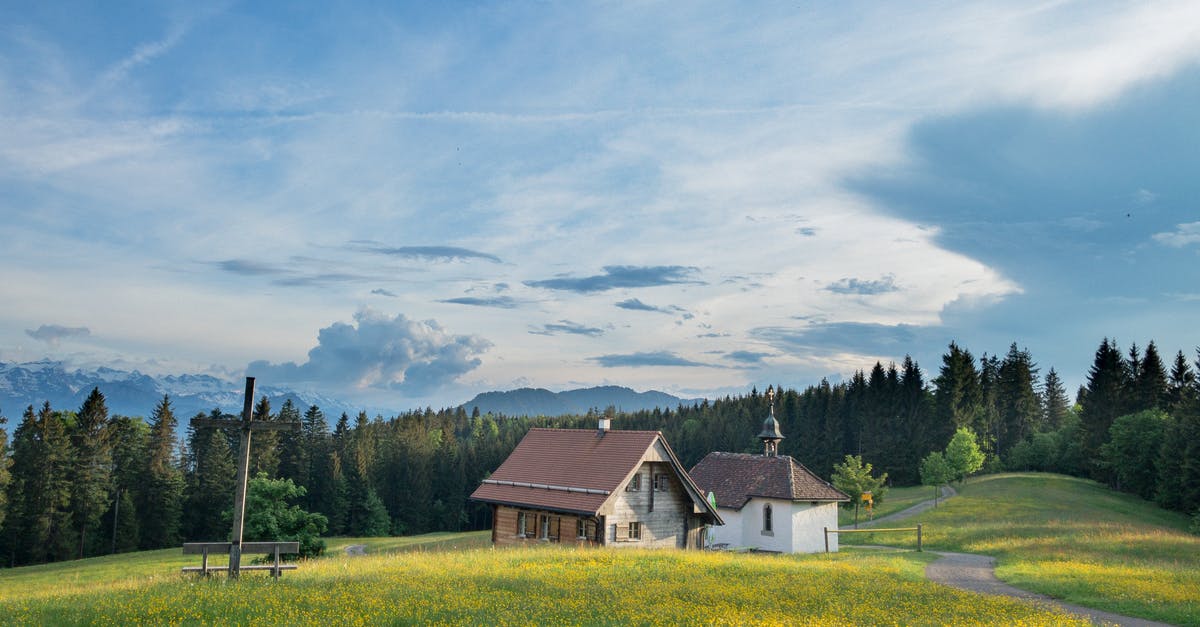 Travelling to Switzerland with covid-19 restrictions - White and Brown House on a Green Field Under Blue Sky Travelling to Switzerland with covid-19 restrictions - White and Brown House on a Green Field Under Blue Sky