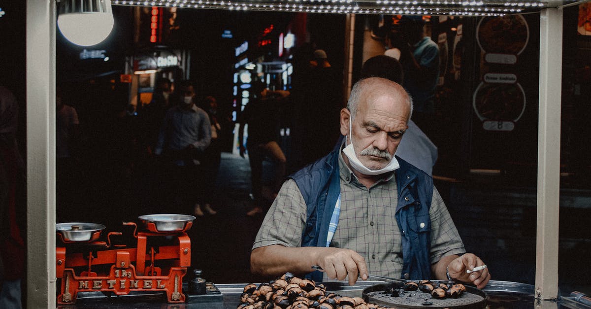Travelling with EU with a receipt of carte de sejour - A Man Cooking on the Street Travelling with EU with a receipt of carte de sejour - A Man Cooking on the Street